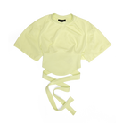A pale yellow short-sleeve crop top with a tie-front detail, laid flat on a white background.